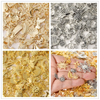 A collection of mixed metal charms and findings for DIY jewelry making, displayed in gold and silver tones.