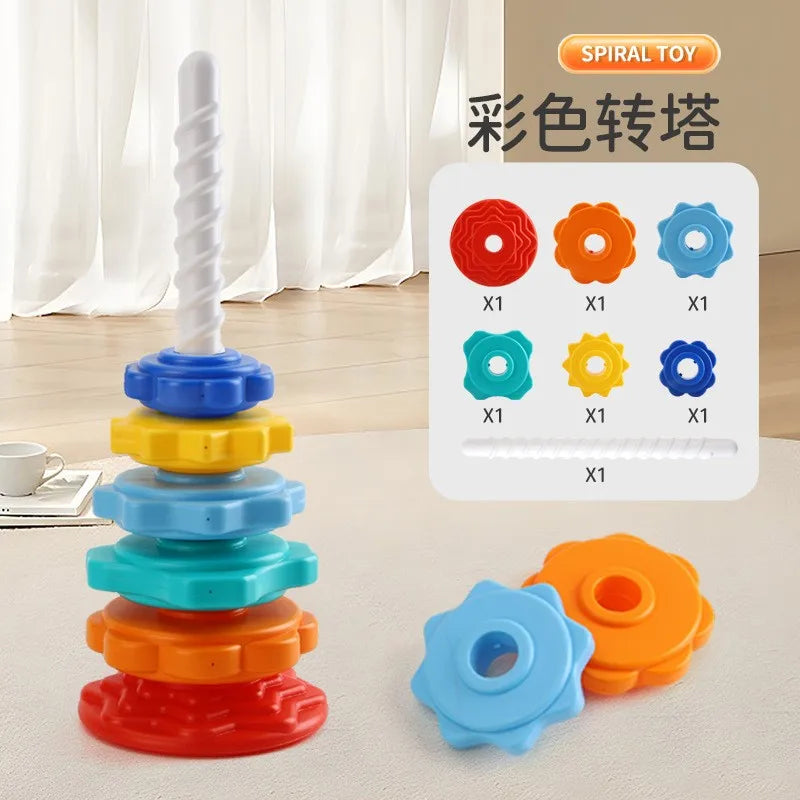 A colorful spiral toy stacking tower made of rings in red, orange, yellow, and blue for toddlers.