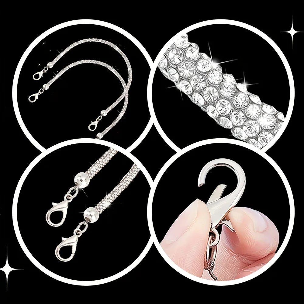 Close-up view of sparkling rhinestone purse straps and a silver clasp on a finger.