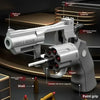 A silver Smith & Wesson revolver dart blaster with a grip and magazine shown in detail.