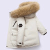 A cream-colored kids' hooded winter jacket with a thick, fluffy brown fur collar.