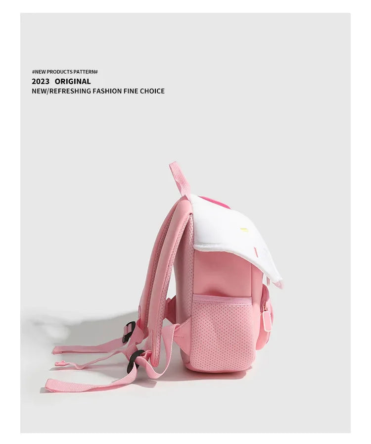 A pink mini backpack with a white mushroom print detail shown against a light gray background.