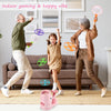 A woman and a man are playing with a pink foot launcher flying disc toy set indoors.