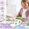 A child is playing with a set of four wooden unicorn jigsaw puzzles for toddlers.