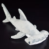 A white super soft hammerhead shark plush toy viewed from the side against a dark background.