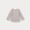 A light beige long-sleeved knit sweater for a toddler.