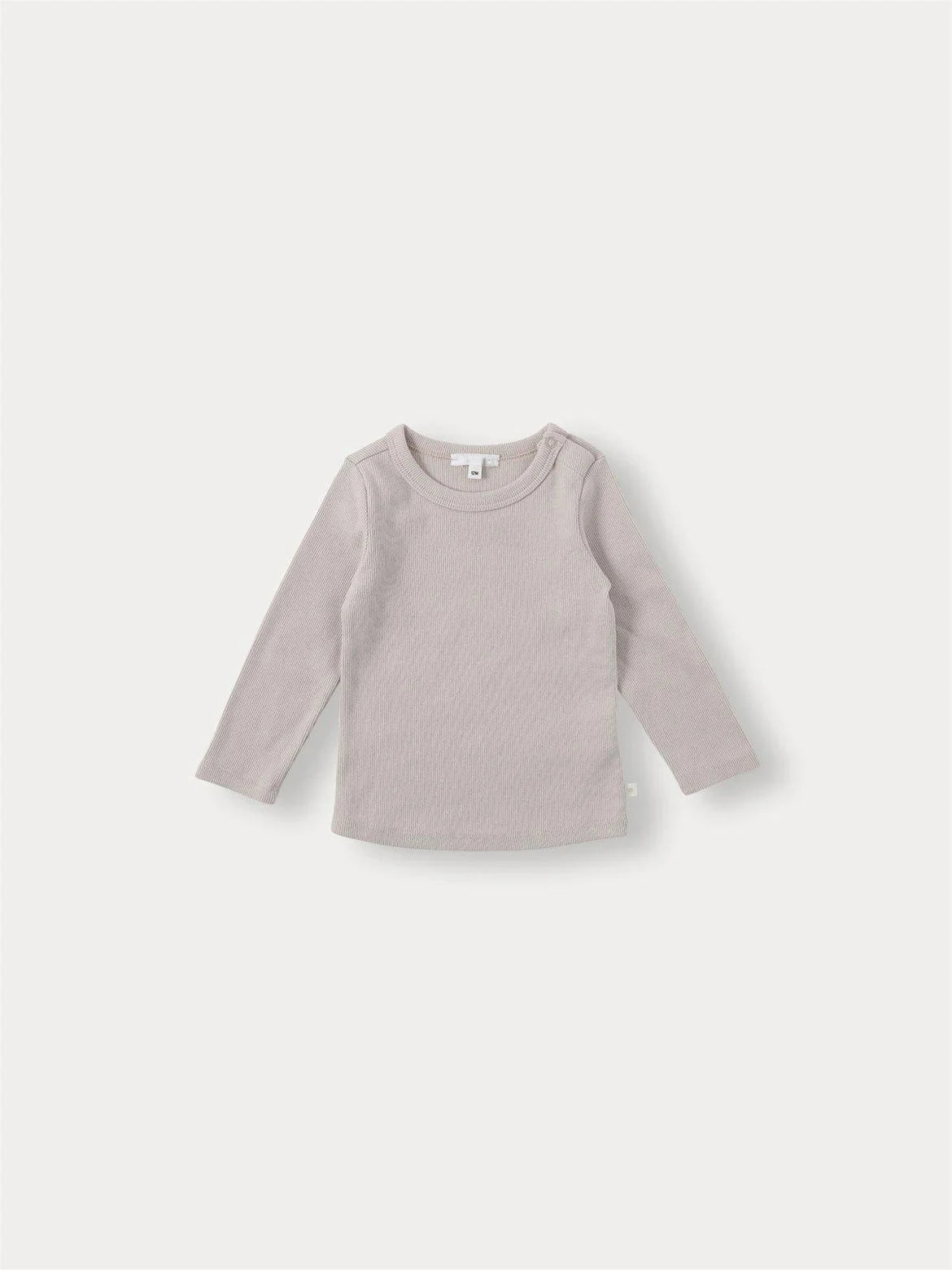 A light beige long-sleeved knit sweater for a toddler.