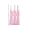 A set of seven pink aluminum crochet hooks with color-coded handles displayed vertically.