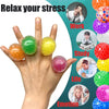 A hand holds several colorful soft rubber stress balls with labels indicating different emotional contexts like Work, Study, 