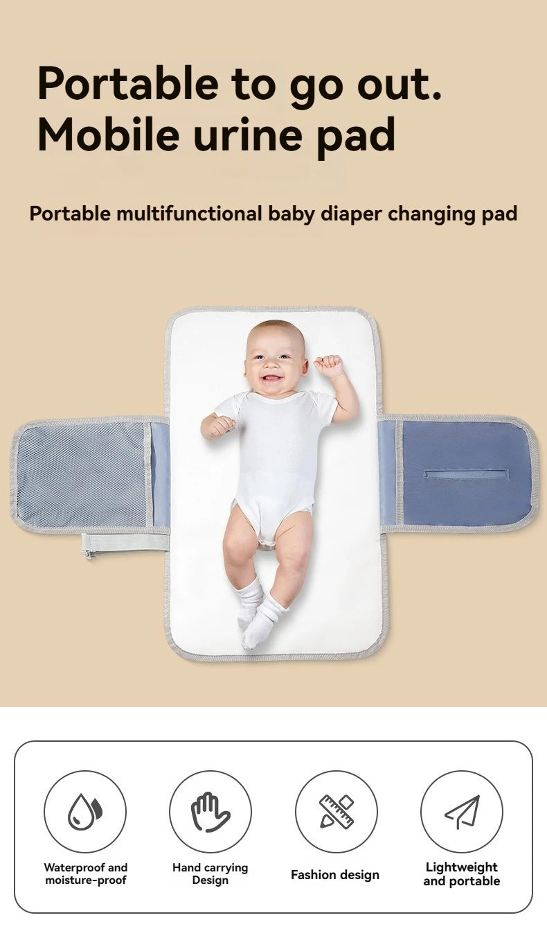 A portable waterproof baby diaper changing pad with a carry handle shown against a light background.
