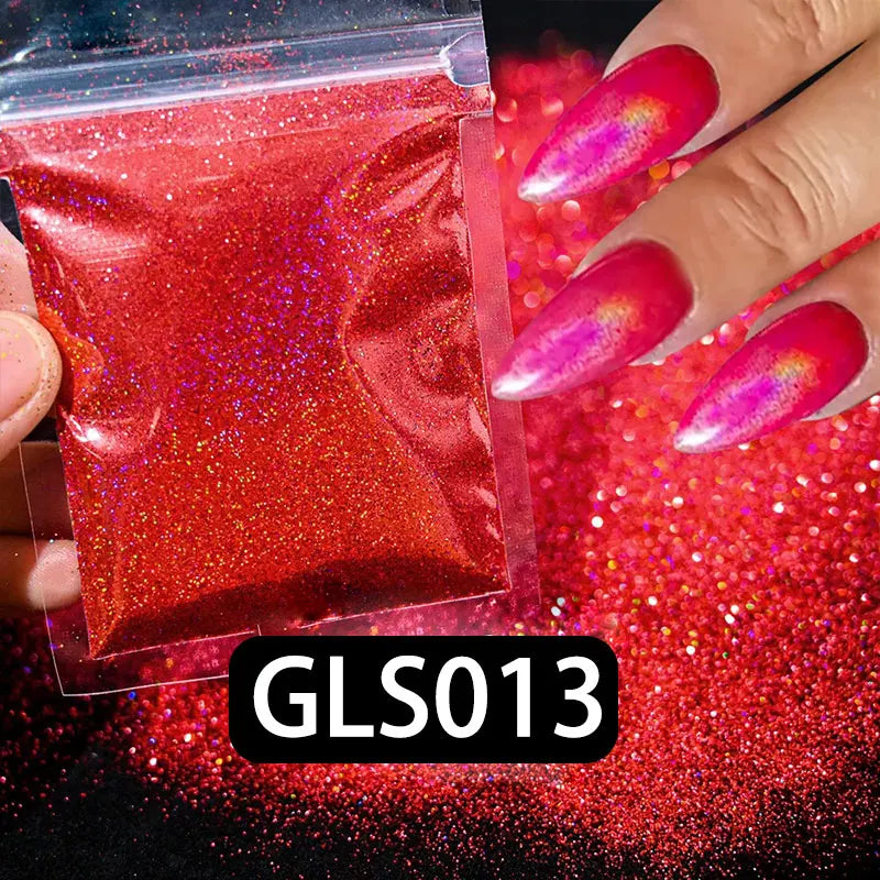 A hand displays a vibrant red holographic nail glitter product with fine sparkle dust on a dark background.