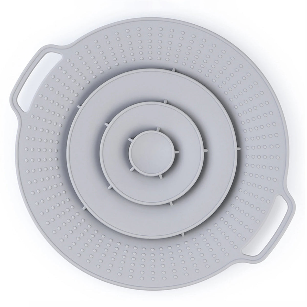 A silicone spill stopper lid with concentric rings and perforated edges for pots and pans.