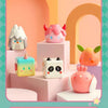 A collection of pink and white geometric monster mini bean blind box vinyl figures displayed on a light pink background.