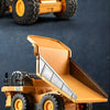 A yellow alloy remote control engineering vehicle set featuring large tires and a dump bed.