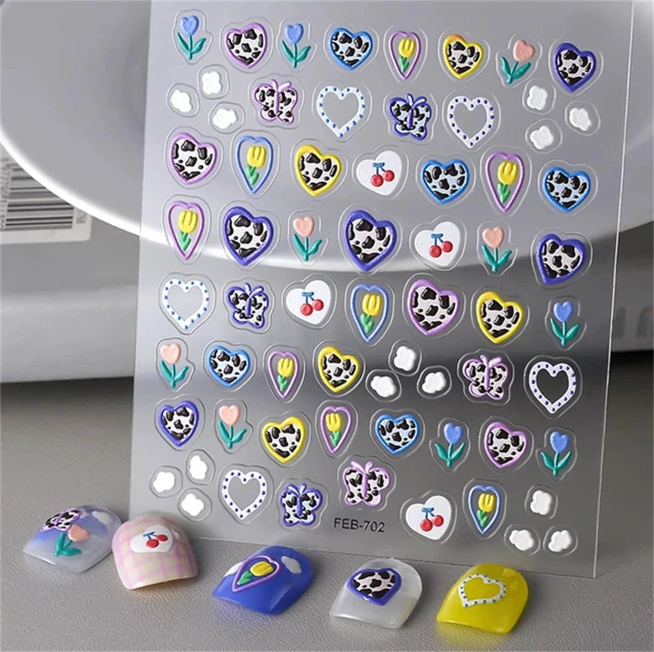 Sheet of 5D bronzing gothic nail art stickers featuring various heart and floral designs on a clear background