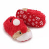 A pair of red fuzzy animal-themed baby first walker shoes with white snowflake patterns.