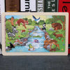 A 24-piece wooden jigsaw puzzle featuring various woodland animals like a deer, fox, birds, and other creatures.