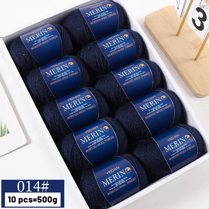 A box of YEDAN MERIN worsted wool thread yarn in navy blue color, showing ten balls.