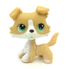 A small, standing dog figure resembling a Jack Russell Terrier in light tan and white colors.
