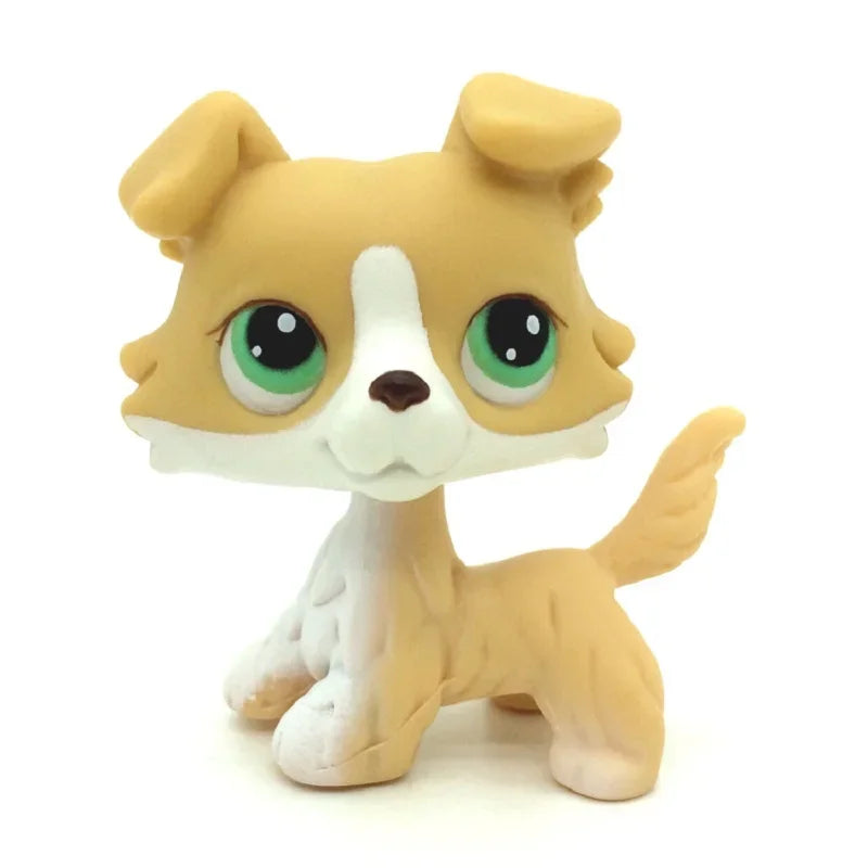 A small, standing dog figure resembling a Jack Russell Terrier in light tan and white colors.