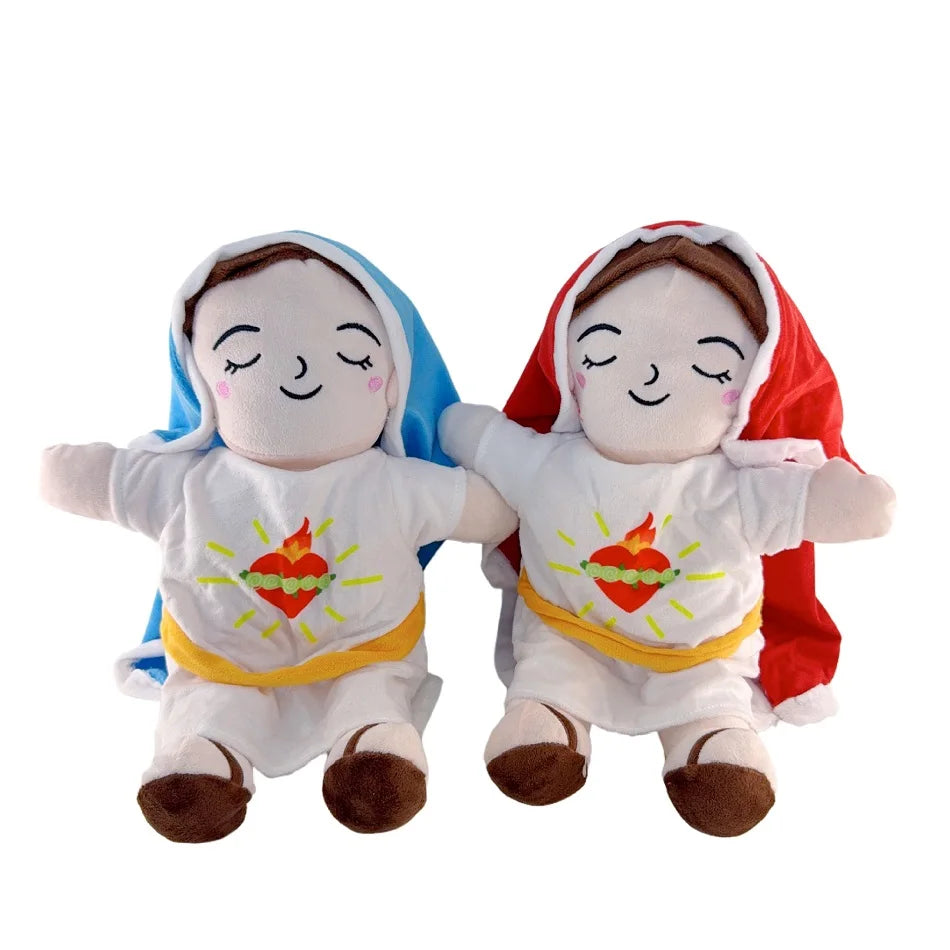 Two plush toys of baby figures with faces closed, wearing white outfits and colored hoods.