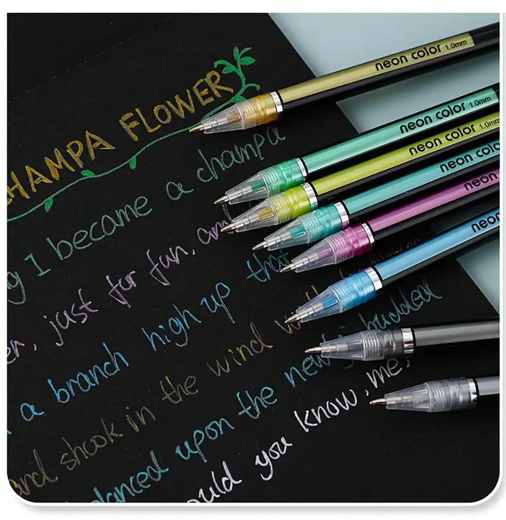 A collection of metallic glitter gel pens in various colors resting on a black surface.