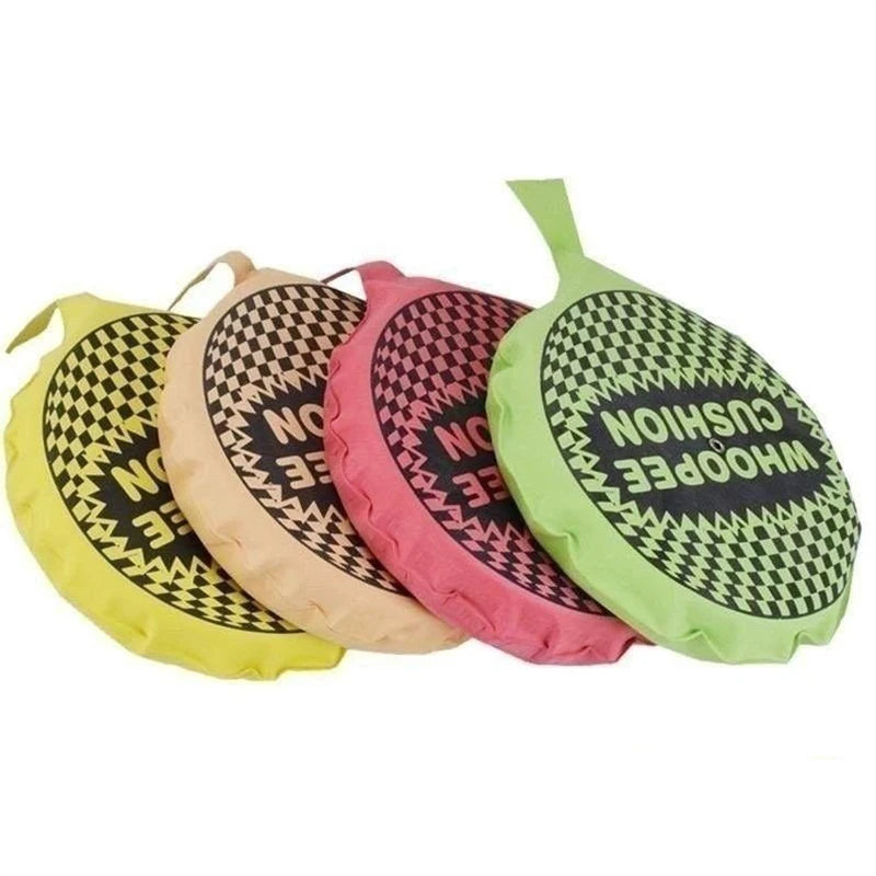 A set of five classic whoopee cushions in yellow, pink, and green.