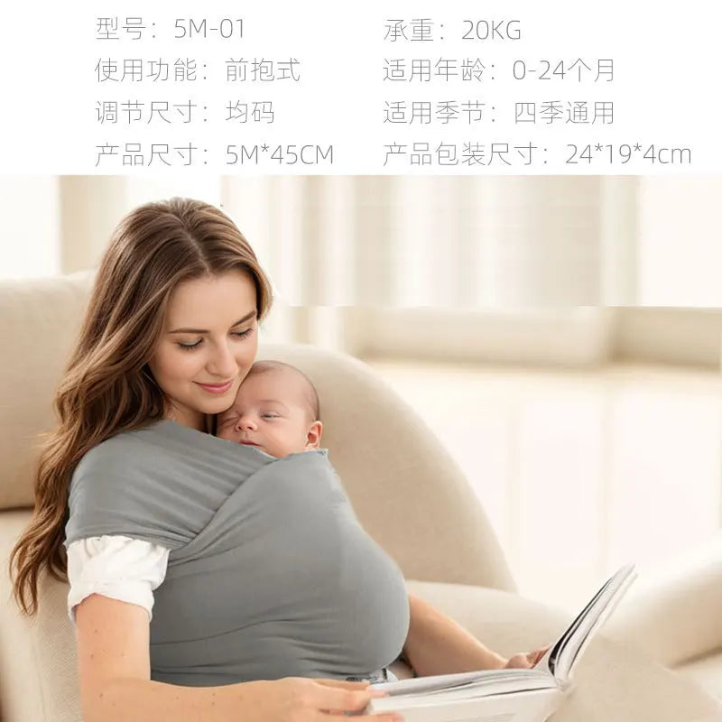 A woman is wearing an ergonomic baby sling carrier while sitting on a sofa, holding a baby.