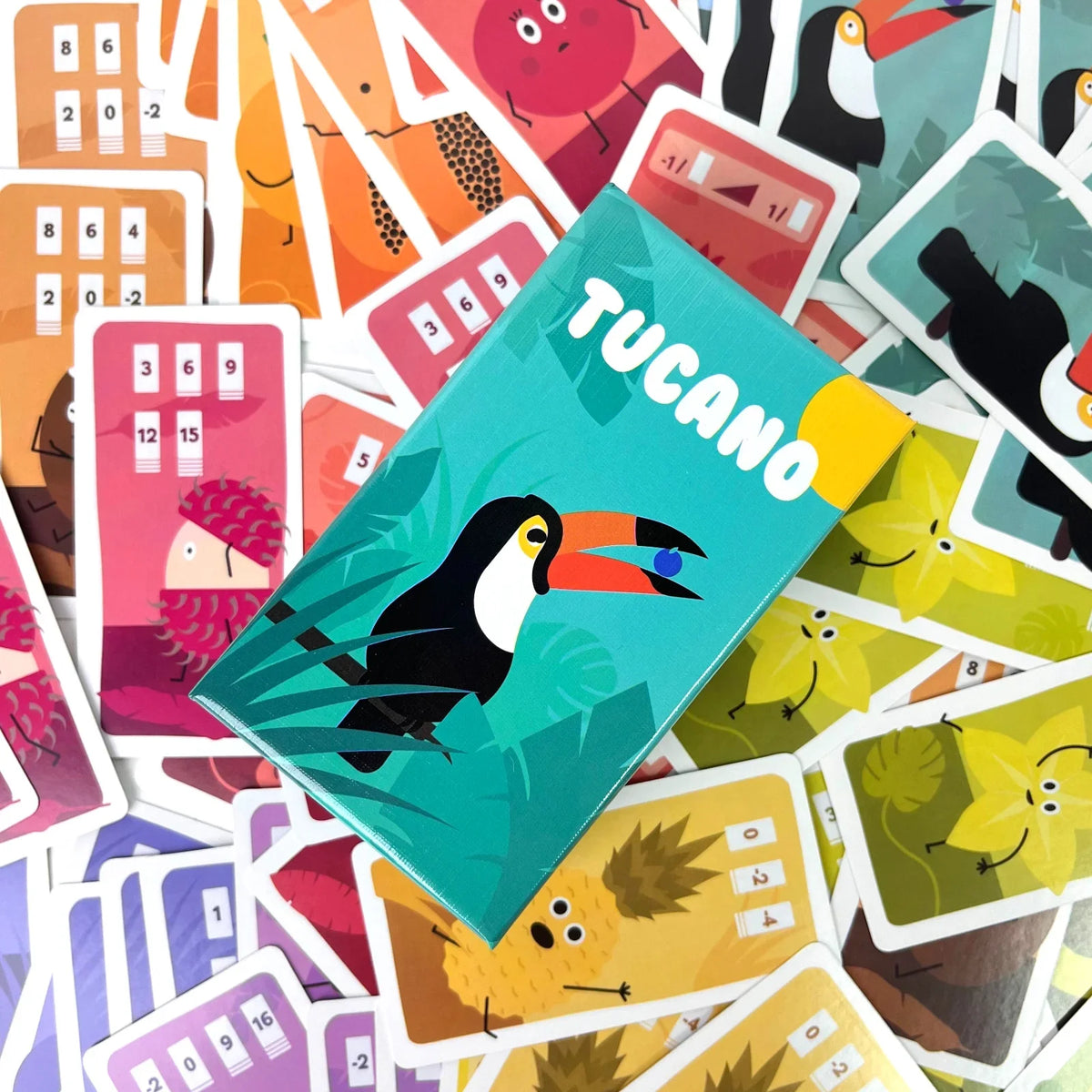 A collection of colorful cards for the Tucano card game featuring illustrations of toucans and tropical elements.