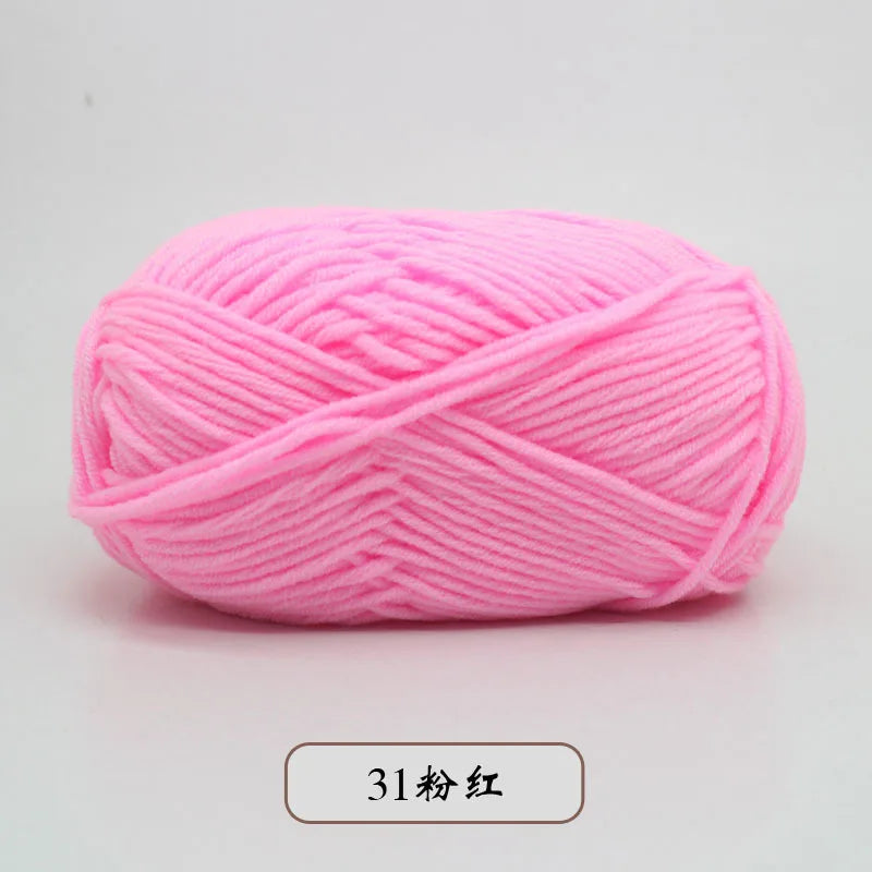 Pink pre-dyed milk cotton yarn in a skein for knitting and crochet