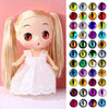A craft doll with long blonde hair and a white dress, featuring multiple colored glitter eyes.