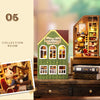 A wooden miniature dollhouse kit featuring a study room facade and an adjacent display cabinet with various small figures and