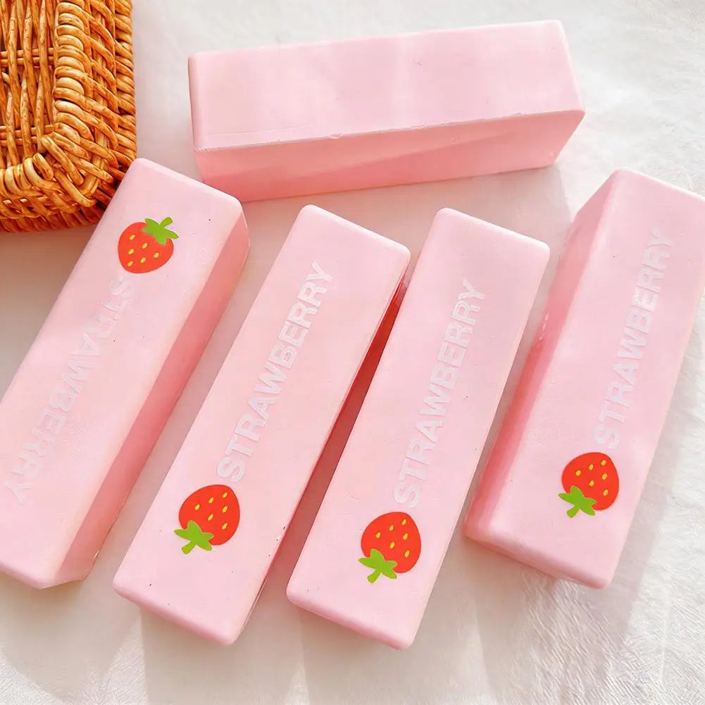 Pink strawberry shaped squishy stress relief toy in a rectangular box