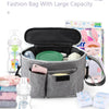 A gray fashion bag with a large capacity, featuring an interior organizer for bottles and accessories.