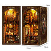 A detailed wooden book nook kit featuring a diorama of a historical scene with warm LED lighting.