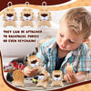 A young boy is holding several small lion and tiger plush toys for gifts or party favors.