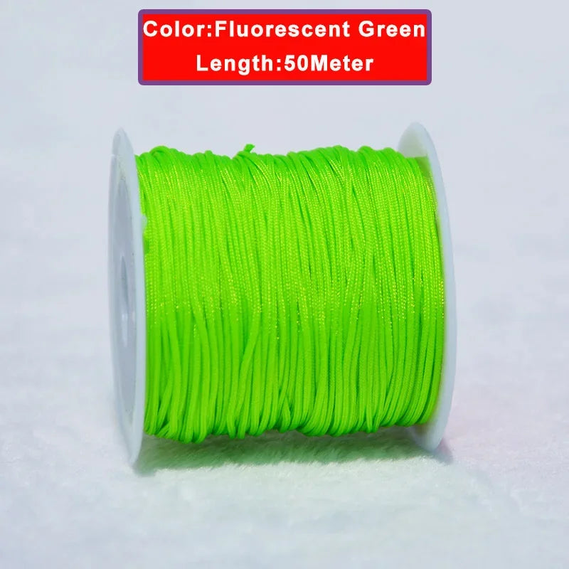 A spool of fluorescent green nylon knotting cord for jewelry making, 50 meters long.