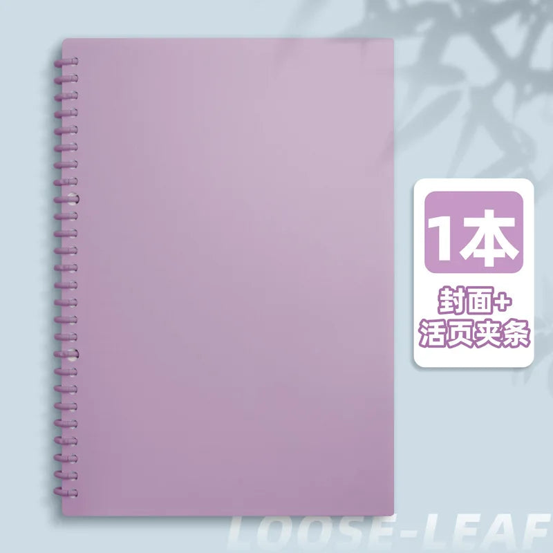 A pink spiral notebook with a purple cover and a label indicating one book with a cover and history.