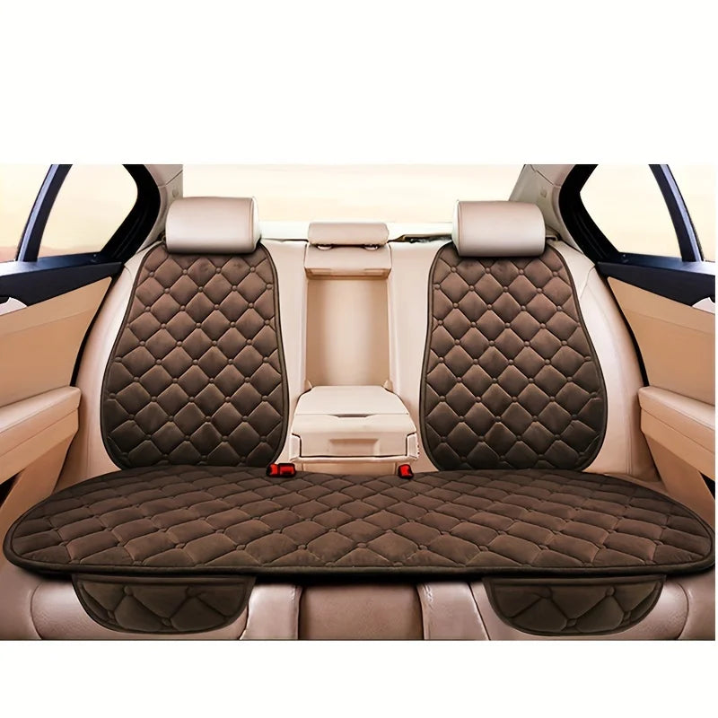 Interior view of a car seat with three plush anti-slip cushions for winter warmth