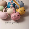 A collection of soft silicone panda-themed pacifier storage bags in various pastel colors and shades.