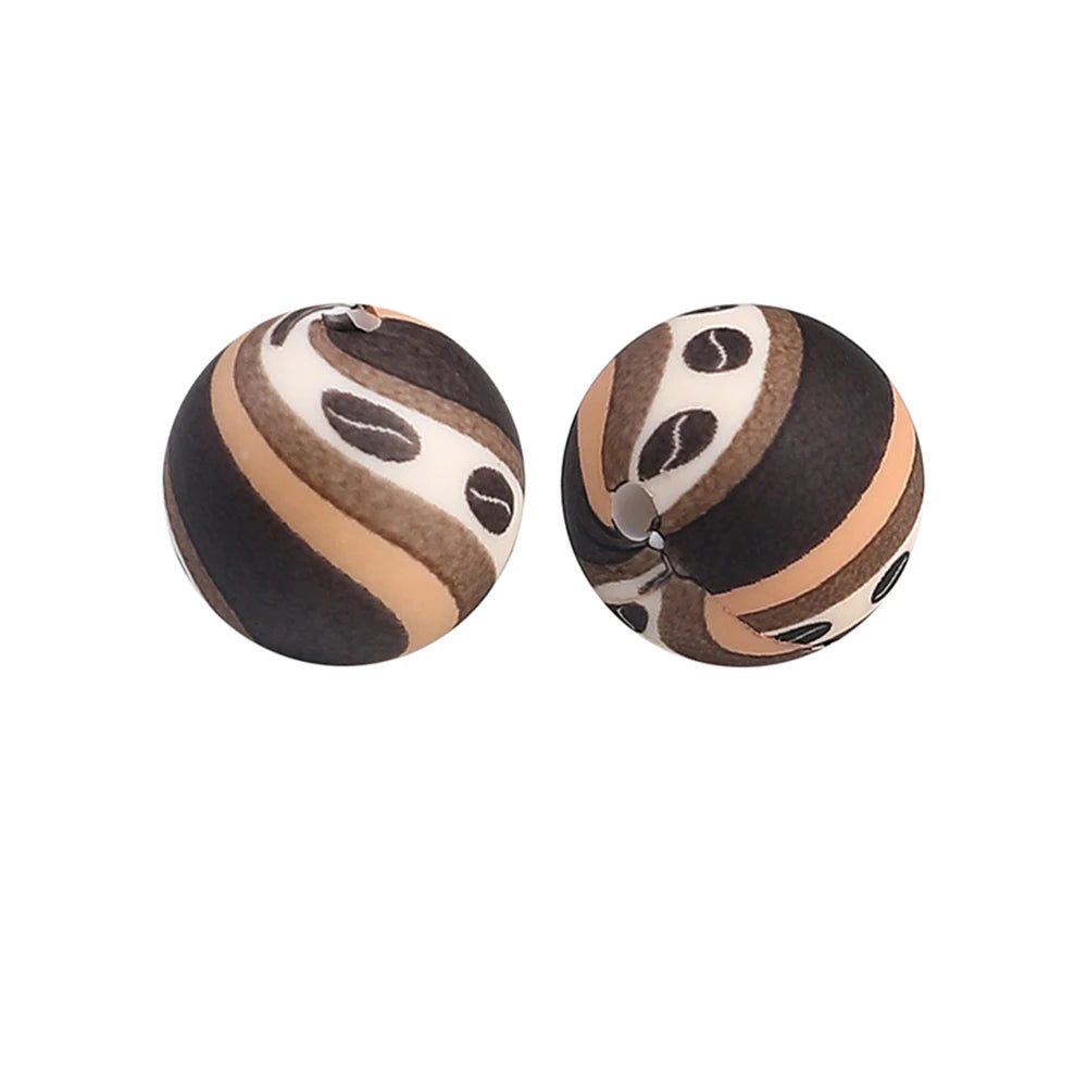 Two round silicone beads with a brown and black marbled pattern for jewelry making
