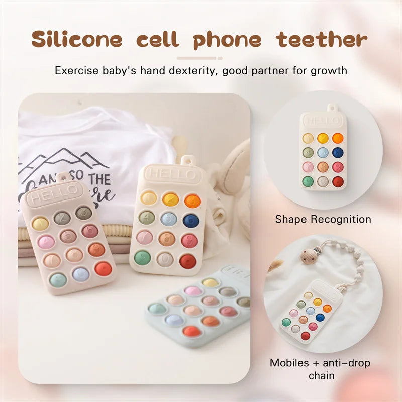A silicone cell phone teether toy with colorful buttons and a mobile attachment shown next to a baby's hand.