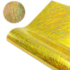 A close-up of holographic glitter heat transfer vinyl sheet showing iridescent gold and green fibers.