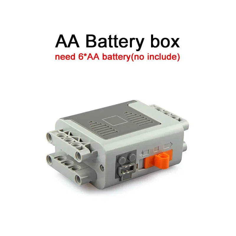 A gray AA battery box with connectors and a small orange component.