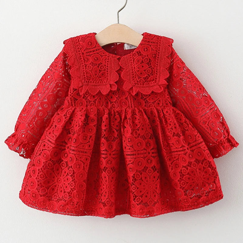 A red lace princess dress for a toddler girl featuring a doll collar and intricate eyelet embroidery.