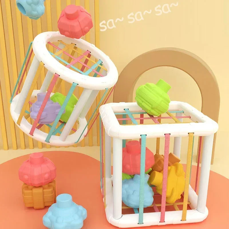 A set of colorful sensory sorting blocks for babies and toddlers, including a wooden-like structure with various colored plas