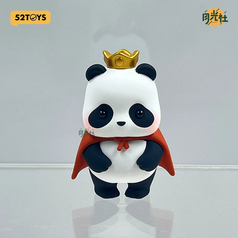 A collectible figure of a panda wearing a gold crown and an orange cape.