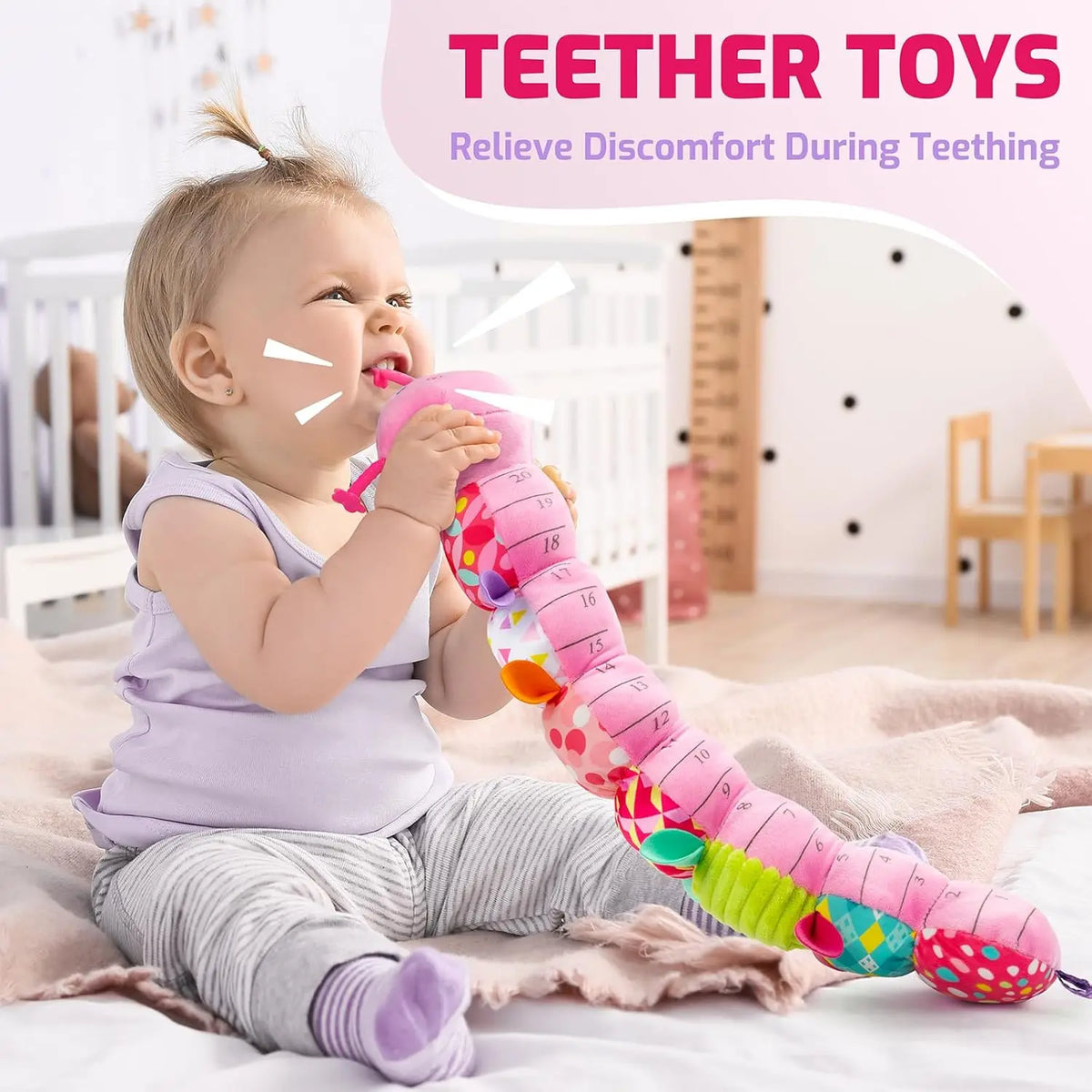 A baby is playing with a colorful, soft caterpillar plush toy designed for teething and sensory play.