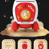 A red and white rocket spacecraft toy is shown on a moon surface, with separate packages for stickers before and after decora