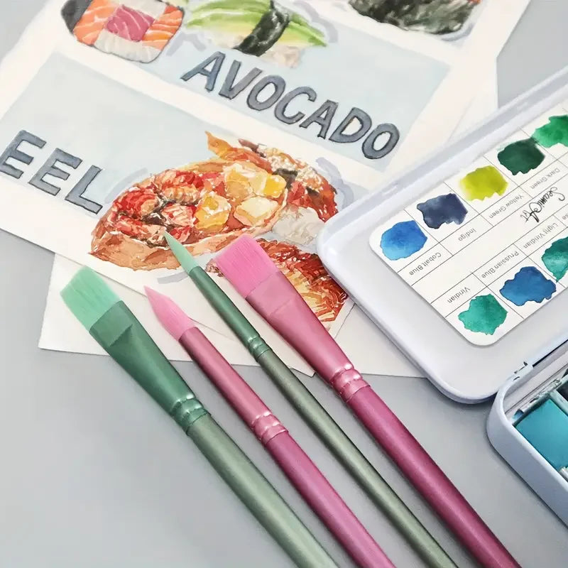 A set of six nylon paint brushes in various shades of pink and green laid out on a gray surface.
